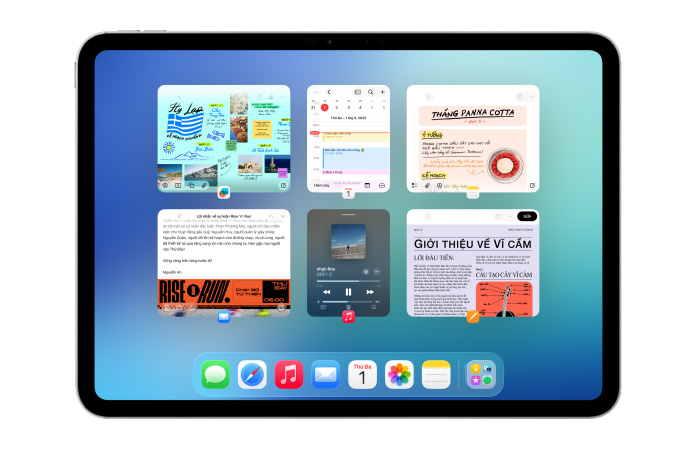 iPad, nằm ngang, màn hình hiển thị nhiều ứng dụng như ứng dụng Lịch và Nhạc trong sáu cửa sổ xếp thành hai hàng để hiển thị các cửa sổ bằng nhau